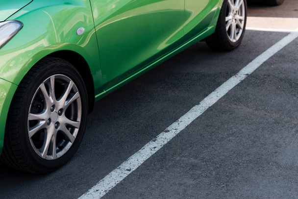 detail of green shiny car on parking lot  - Photo, Image