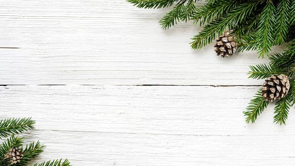 Christmas Fir tree branches and pine cones background - Foto, Imagen