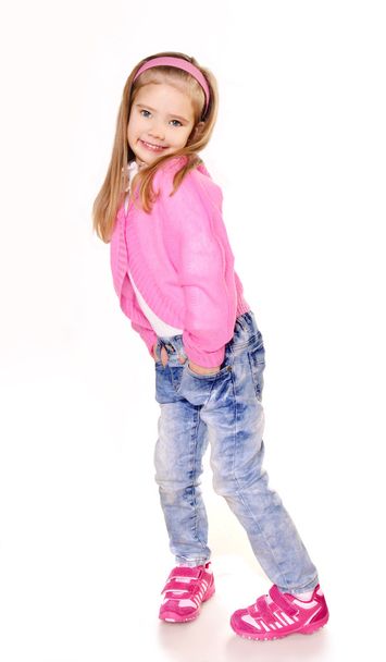 Portrait of cute little girl in jeans isolated - Fotó, kép