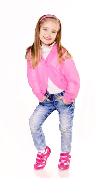 Portrait of cute little girl in jeans isolated - Zdjęcie, obraz