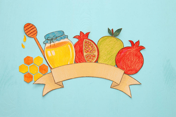 Rosh hashanah (jewish New Year holiday) concept. Traditional symbols shapes cut from paper and painted - Zdjęcie, obraz