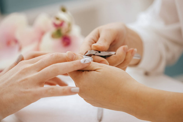 Manicurist does manicure, close-up view  - Zdjęcie, obraz