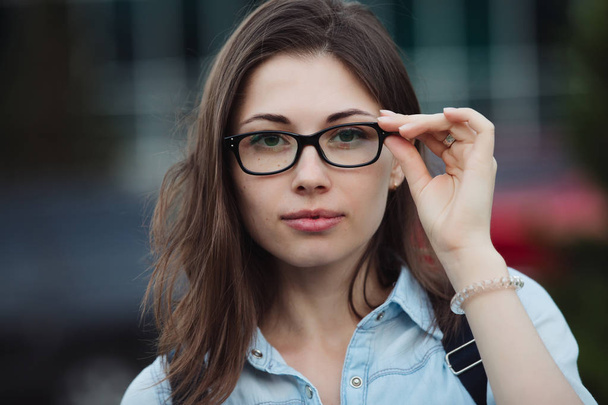 Student girl portrait outdoors closeup in eye glasses for good vision - Photo, image