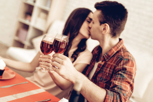 Couple Romantic Dinner At Valentine's Day. Love Each Other. Sweetheart's Holiday Concept. Wine Drinking. Feelings Showing. Celebrating Date Together. Young And Handsome. Beautiful Kiss. - Φωτογραφία, εικόνα