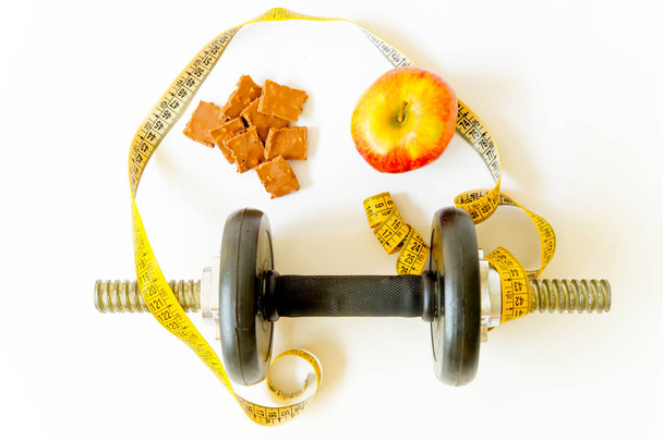 scales and and fruit on a floor, training and healthy lifestyle concept - Photo, Image