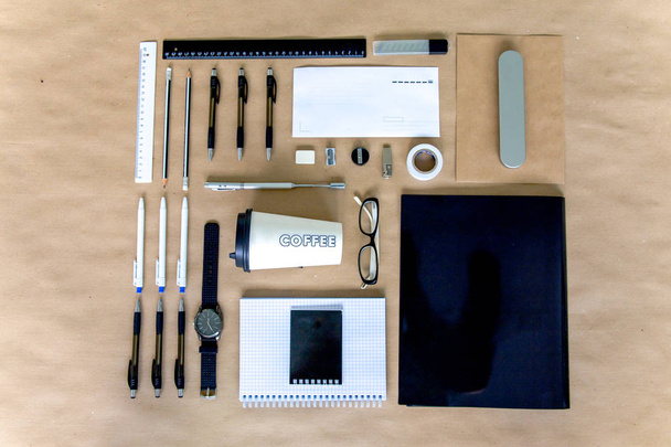 stationery pen scissors notebook on a wooden table - Foto, Bild