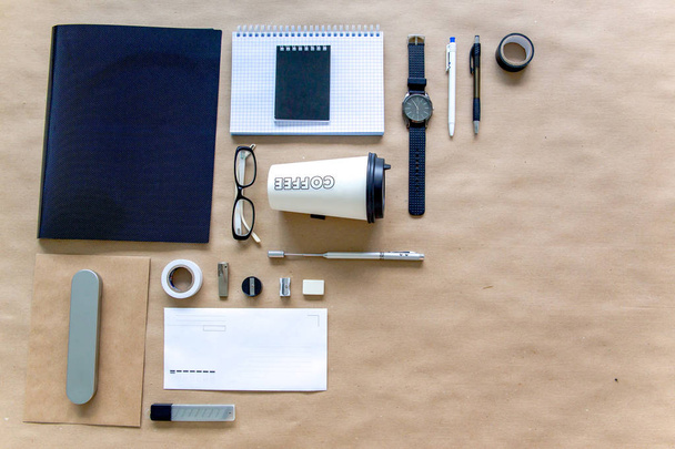 stationery pen scissors notebook on a wooden table - Zdjęcie, obraz