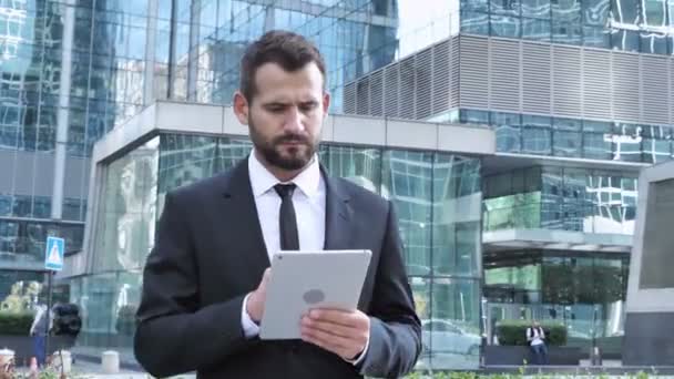 Walking Businessman Using Tablet, Outside Office - Footage, Video