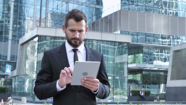 Businessman Using Tablet for Browsing, Standing Outside Office - Video