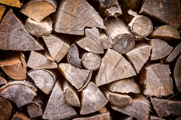 Firewood neatly stacked. Background with texture of wood. - Photo, Image