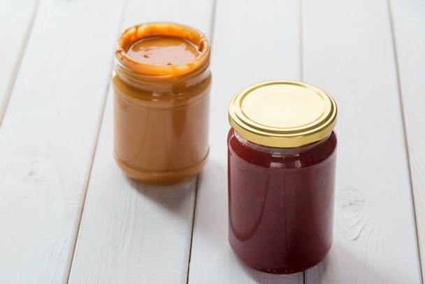 Peanut butter and jelly jars - Фото, изображение