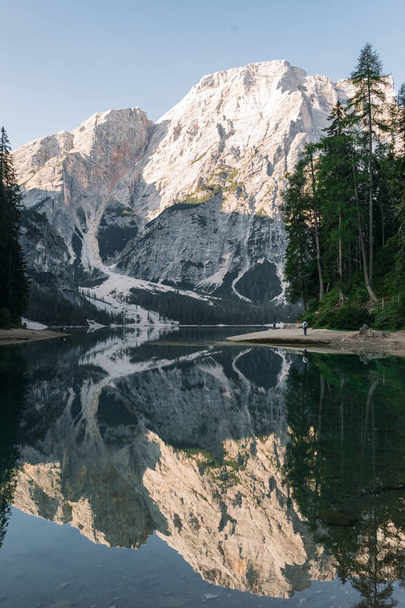 scenic view of fascinating clear lake in mountains, Lago di Braies, Italy - 写真・画像