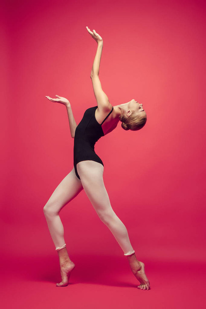 Young teen dancer on red studio background. - Foto, Imagem