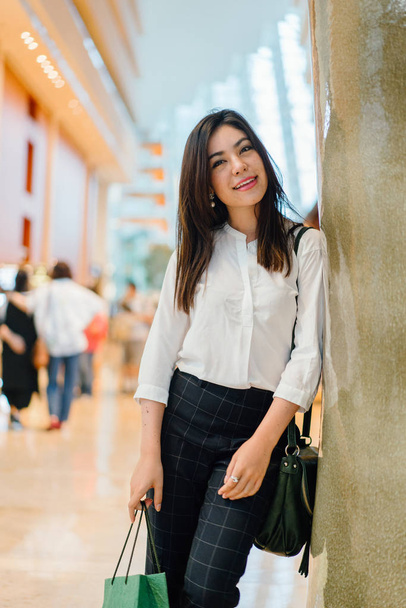 Young attractive asian woman with shopping bag in the mall  - Fotoğraf, Görsel