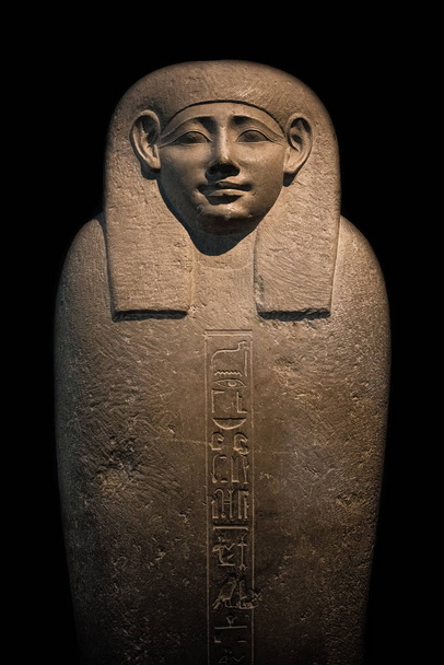 Massive granite sarcophagus of Egyptian pharaoh illuminated and isolated at black background, Egypt, details, extreme closup - Photo, Image