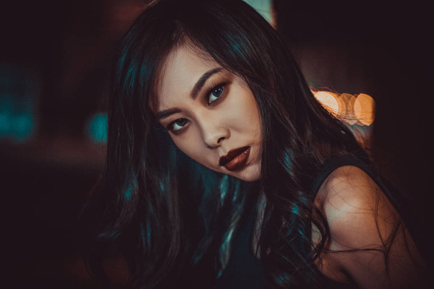Night portrait of young asian woman - Photo, Image