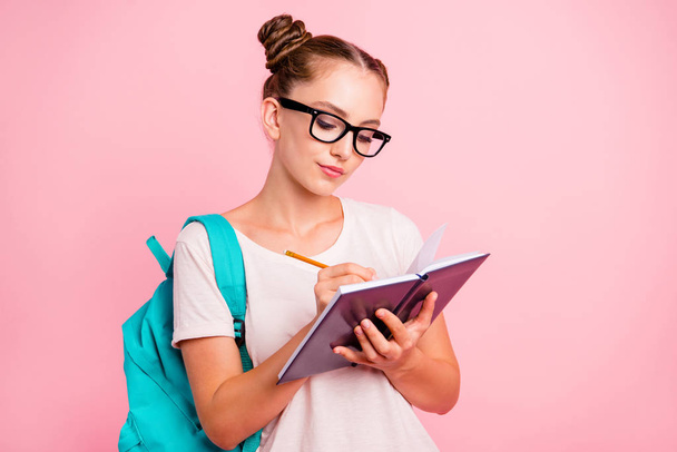 Portrait of concentrated reader student girl writes in notebook  - Fotografie, Obrázek