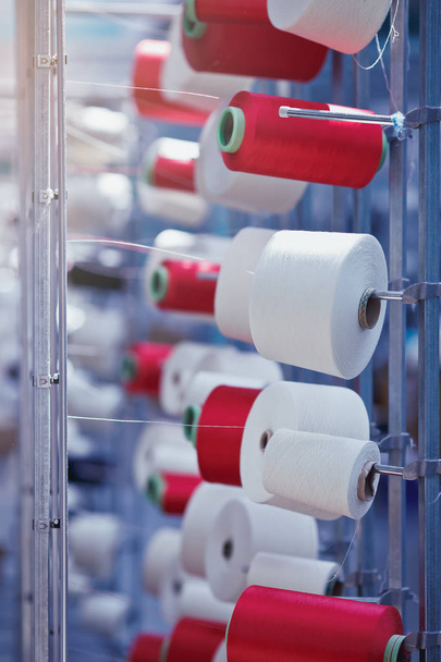 Modern Textile Factory. Rows of automated machines for yarn manufacturing. - Foto, afbeelding