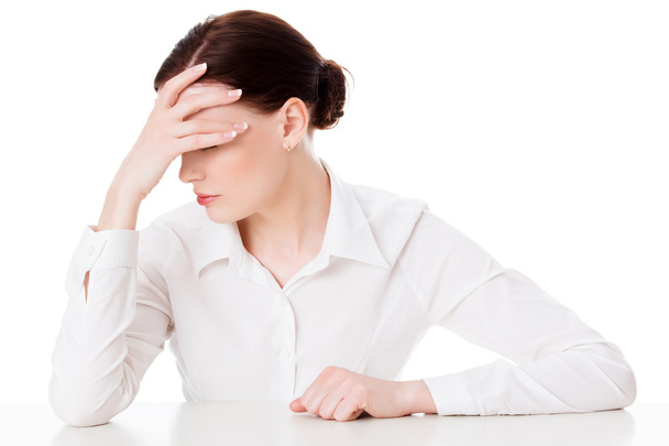 Business woman with headache, white background - Fotoğraf, Görsel