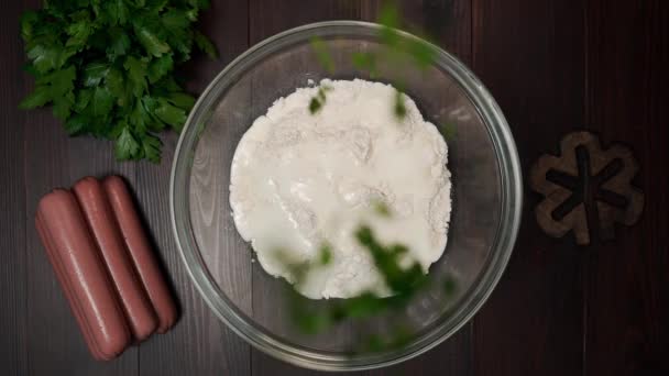 Parsley falls to the bowl with dough, cooking at home, food and bakery, fresh greens at the kitchen - Filmagem, Vídeo