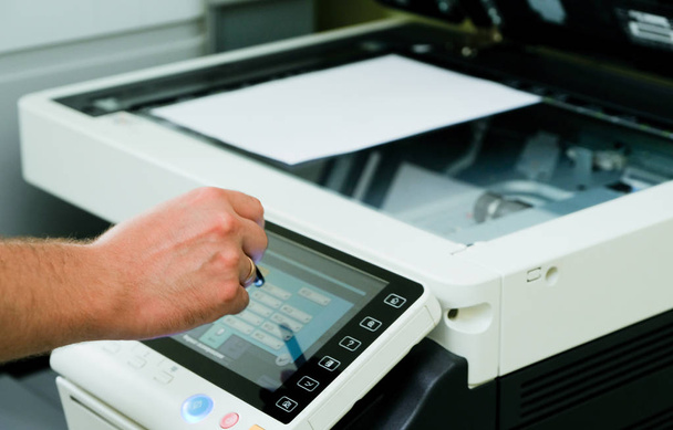 A person controls a scanning device, a close-up shot - Foto, Bild