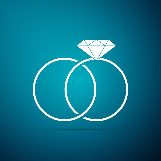 Snubní prsteny ikona izolované na modrém pozadí. Ženich a nevěsta šperky znamení. Ikona manželství. Diamantový prsten ikona. Plochý design. Vektorové ilustrace - Vektor, obrázek