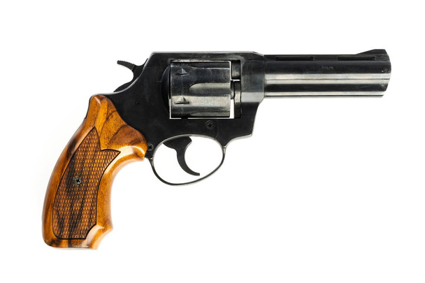 isoliert gebrauchter alter schwarzer Revolver auf weißem Hintergrund - Foto, Bild
