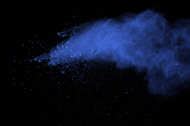 Blue powder explosion on black background. Colored cloud. Color dust explode. Paint Holi. - Photo, Image