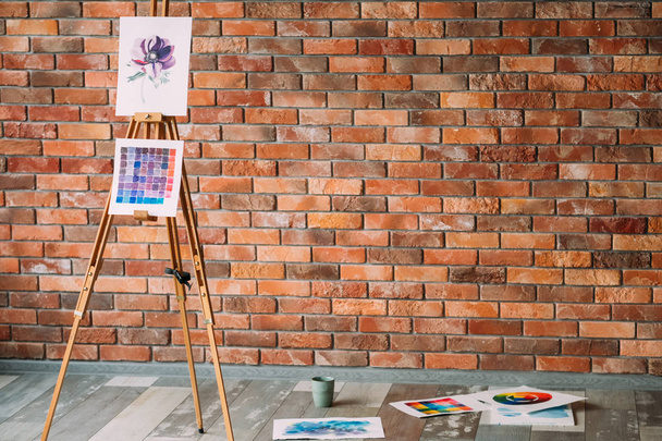 artist workspace painting workshop loft brick wall - Фото, зображення