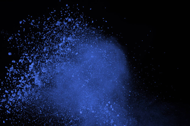 Blue powder explosion on black background. Colored cloud. Color dust explode. Paint Holi. - Valokuva, kuva