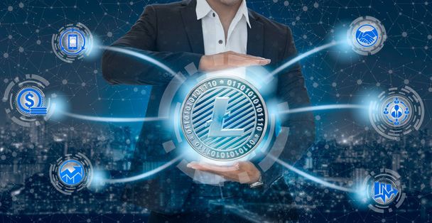 Litecoin and cryptocurrency investing concept - Businessman holding Litecoin (LTC) with mobile application business icons showing exchanging, trading, transfer and investment of blockchain technology. - Photo, Image