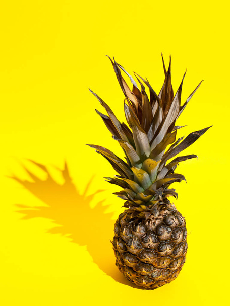Pineapple on yellow background - Φωτογραφία, εικόνα