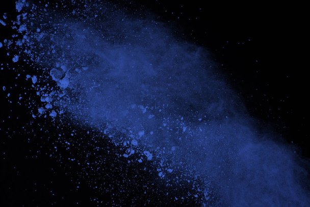 Blue powder explosion on black background. Colored cloud. Color dust explode. Paint Holi. - Photo, Image