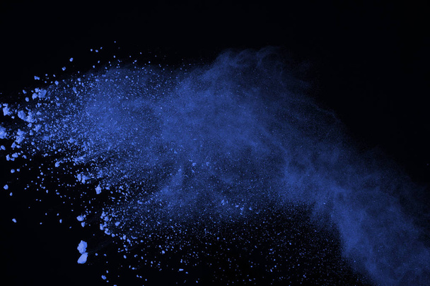 Blue powder explosion on black background. Colored cloud. Color dust explode. Paint Holi. - Fotoğraf, Görsel