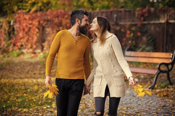 Autumn happy couple of girl and man outdoor. - Photo, image