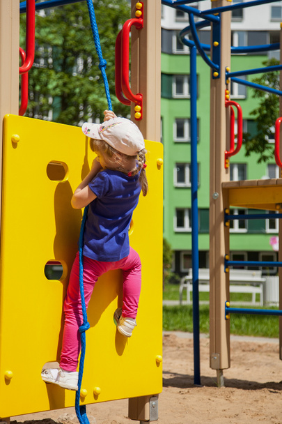 Active little girl on playground - Φωτογραφία, εικόνα