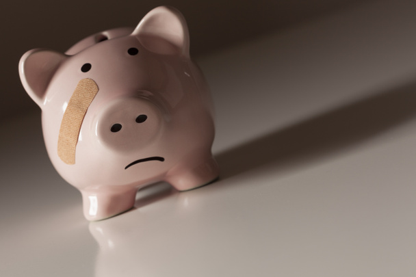 Piggy Bank with Bandage on Face - Photo, Image