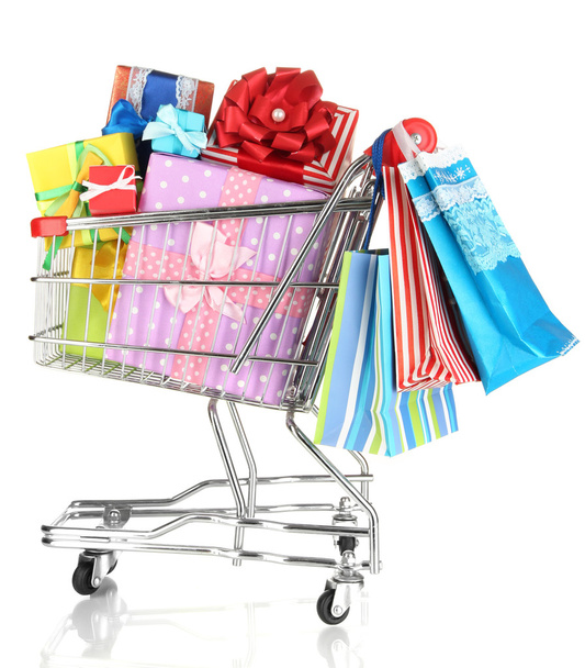 Christmas gifts and shopping in trolley isolated on white - Foto, immagini