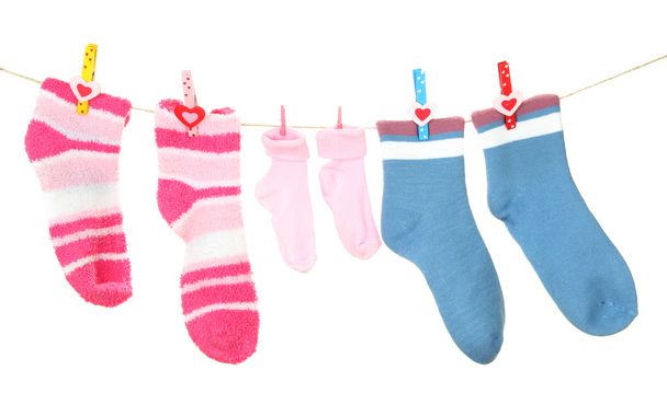 Colorful socks hanging on clothesline, isolated on white - Fotoğraf, Görsel