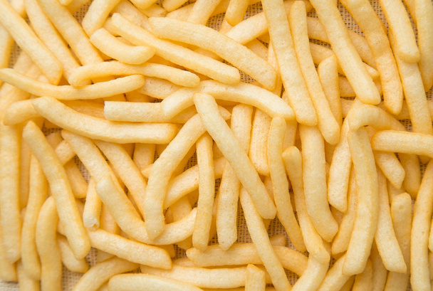 Nahaufnahme von Pommes frites oder Kartoffelbraten, Ansicht von oben. - Foto, Bild
