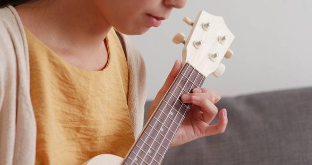 Woman play ukulele close up - Photo, Image