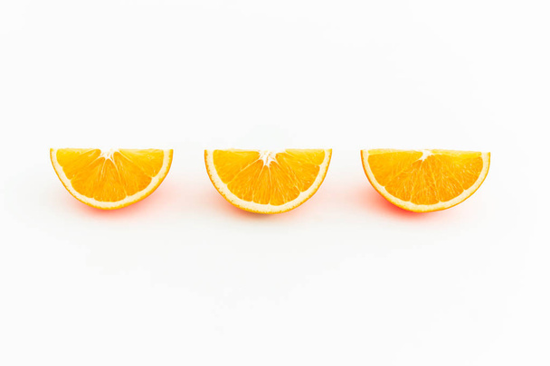 Slices of orange fruit isolated on white background - Foto, Imagem