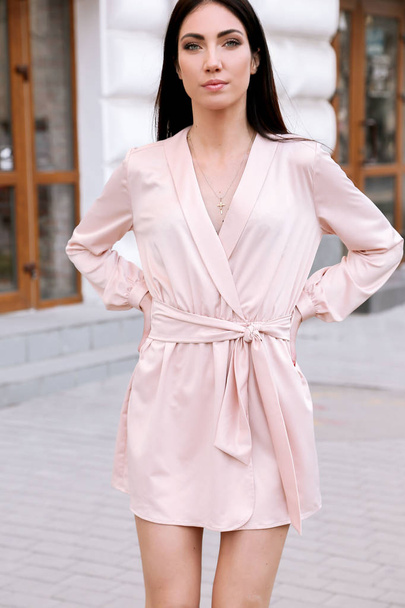 fashion outdoor photo of beautiful woman with dark hair in elegant clothes walking aroung the summer city - Photo, image
