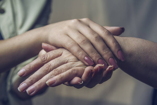 Helping hands, care for the elderly concept - Foto, Bild