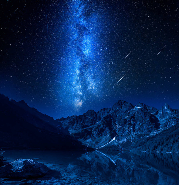 Falling stars, milky way at the lake in Tatras, Poland - Photo, Image
