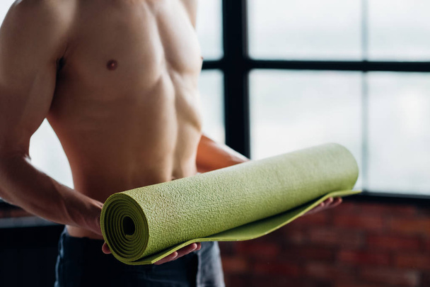 sport fitness gym training body man hold yoga mat - Foto, Imagen