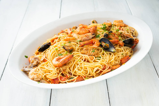 Dish of spaghetti pasta with seafood sauce, Mediterranean food  - Photo, Image
