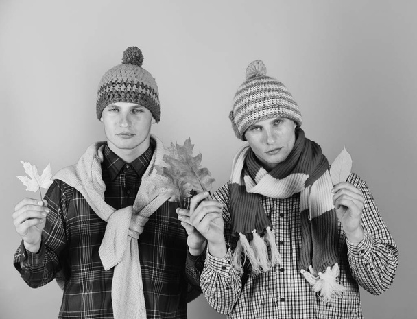Twin brothers wearing warm hats and scarves - Φωτογραφία, εικόνα