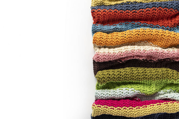 Wool blanket, colorful, knitted large chunky yarn. Close-up of knitted blanket on white background. - Photo, Image