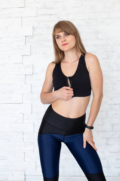 Fitness woman wearing black sexy top. Happy beautiful woman with sport underwear. Healthy lifestyle concept - Zdjęcie, obraz